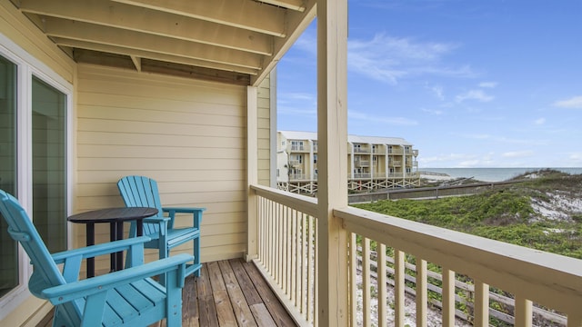 balcony featuring a water view