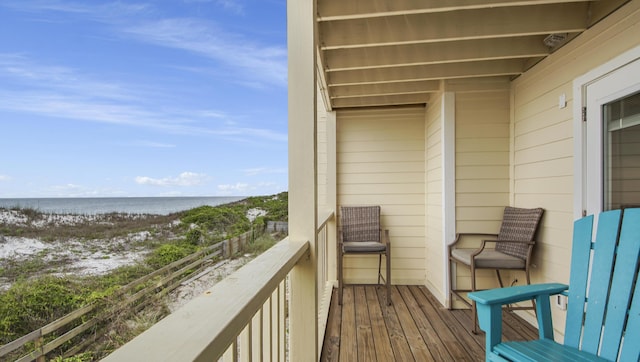 balcony with a view of the beach and a water view