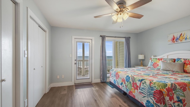 bedroom with access to outside, ceiling fan, baseboards, and wood finished floors