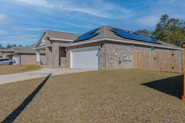 view of front of property with a front lawn, solar panels, and brick siding