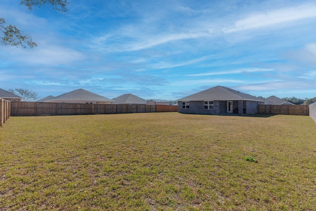 view of yard featuring a fenced backyard