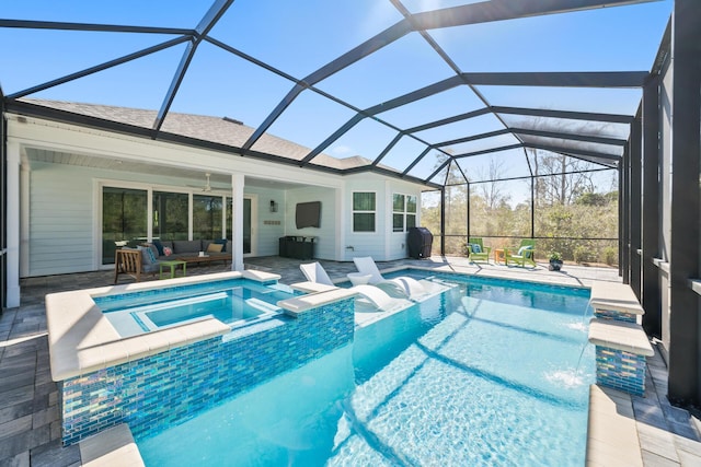 view of swimming pool featuring glass enclosure, a patio area, outdoor lounge area, and a pool with connected hot tub