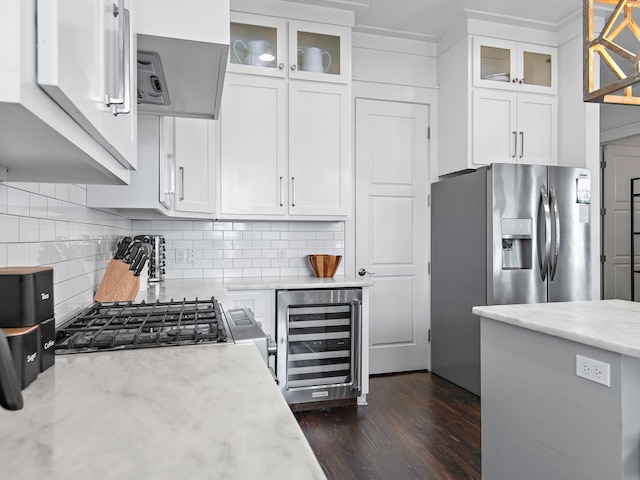 kitchen with white cabinets, wine cooler, stainless steel refrigerator with ice dispenser, and backsplash