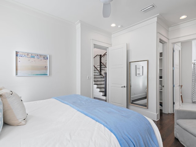 bedroom featuring recessed lighting, wood finished floors, a ceiling fan, visible vents, and crown molding