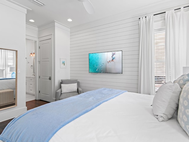 bedroom featuring dark wood finished floors, recessed lighting, visible vents, radiator heating unit, and ceiling fan