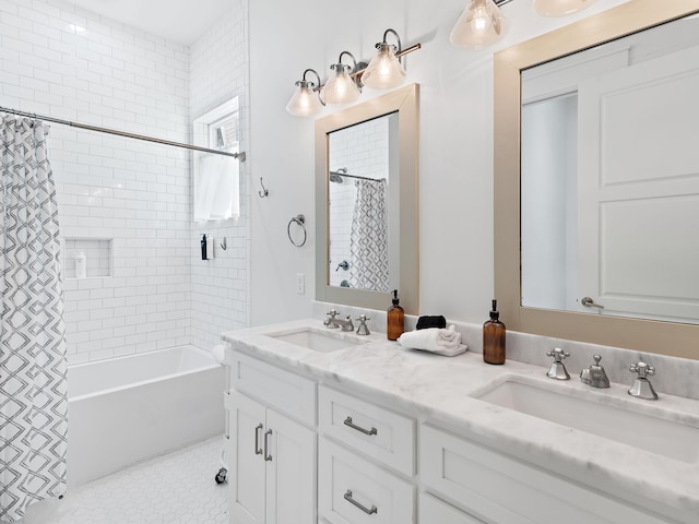 bathroom featuring shower / bath combination with curtain, a sink, and double vanity