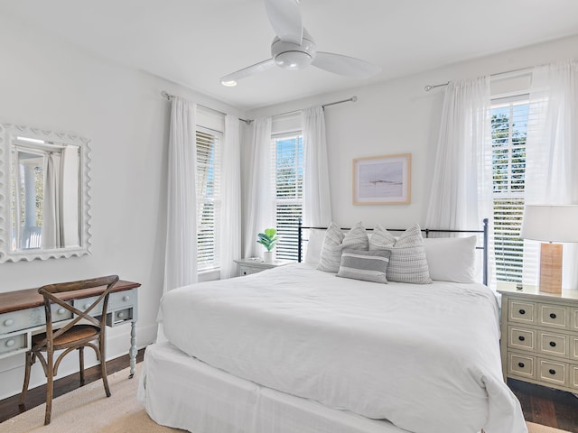 bedroom with wood finished floors and a ceiling fan