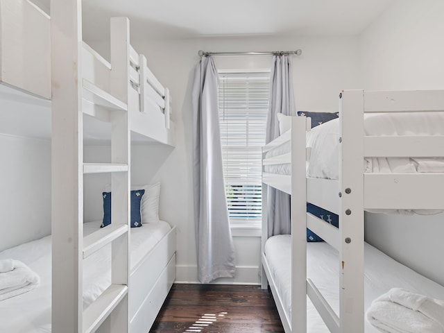 bedroom featuring dark wood finished floors