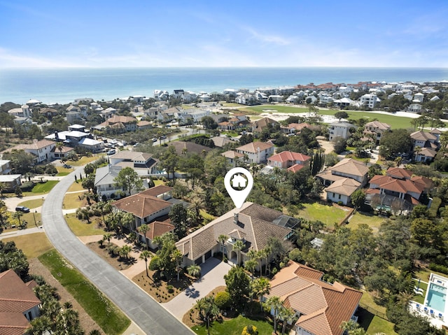 drone / aerial view featuring a residential view and a water view