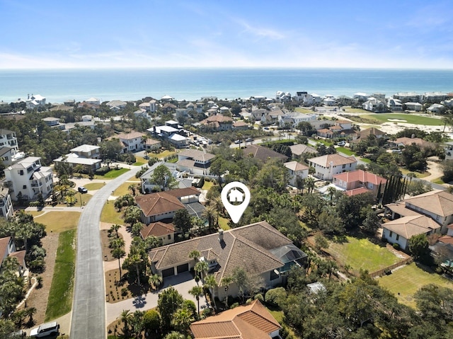 drone / aerial view featuring a water view and a residential view