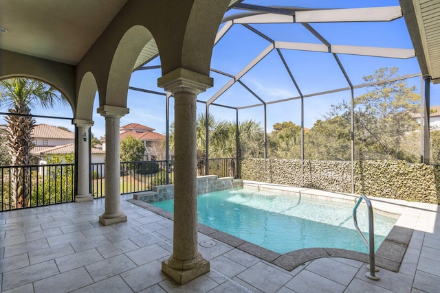 view of swimming pool with a fenced in pool, a patio area, and glass enclosure