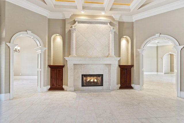 unfurnished living room featuring arched walkways, beam ceiling, decorative columns, a tile fireplace, and coffered ceiling