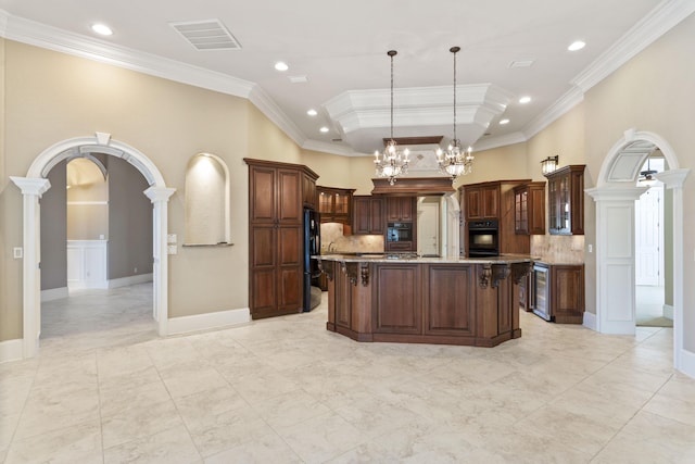 kitchen featuring arched walkways, beverage cooler, visible vents, ornamental molding, and glass insert cabinets