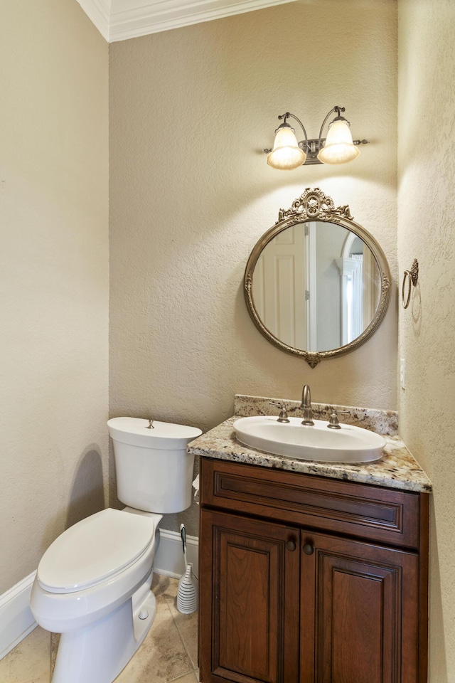 half bath with baseboards, a textured wall, toilet, tile patterned floors, and vanity