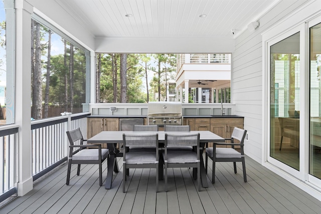 sunroom with wooden ceiling and a sink