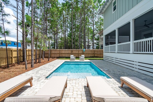 view of swimming pool with a fenced backyard, a fenced in pool, and a patio