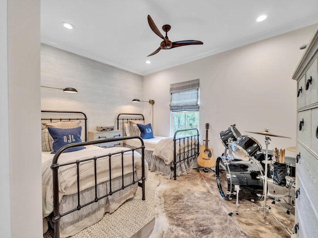 bedroom with crown molding and recessed lighting