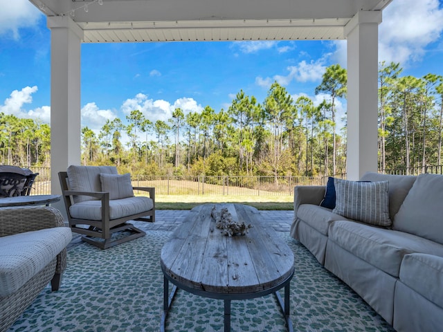 view of patio with fence and outdoor lounge area