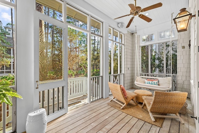 sunroom / solarium with ceiling fan