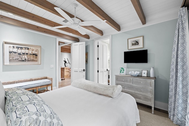 bedroom featuring a ceiling fan, wood ceiling, beamed ceiling, and baseboards