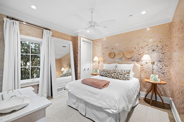bedroom with recessed lighting, ornamental molding, a ceiling fan, baseboards, and wallpapered walls