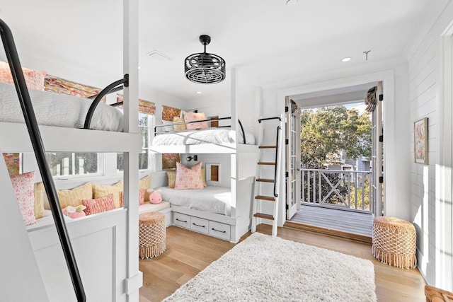 bedroom with light wood finished floors and recessed lighting