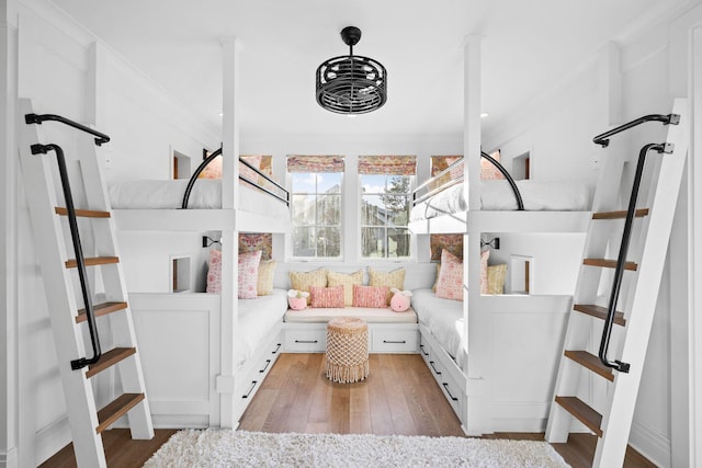 interior space featuring ornamental molding and wood finished floors