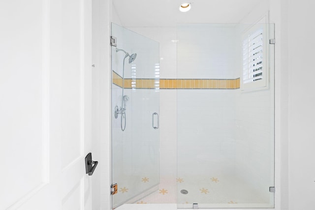 full bath with a shower stall