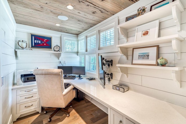 office area with light wood finished floors, built in desk, wooden ceiling, and recessed lighting