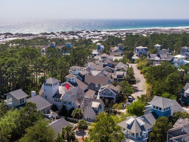 drone / aerial view featuring a water view and a residential view
