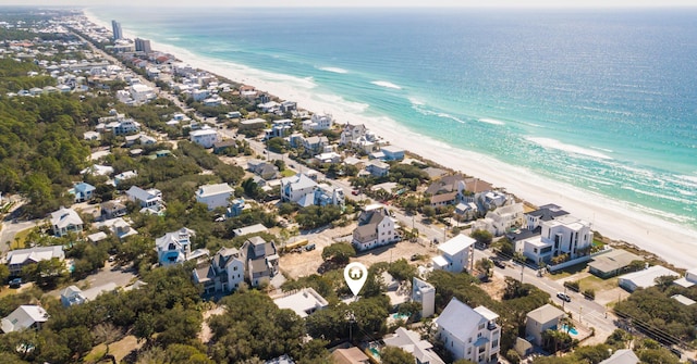 birds eye view of property featuring a view of the beach and a water view