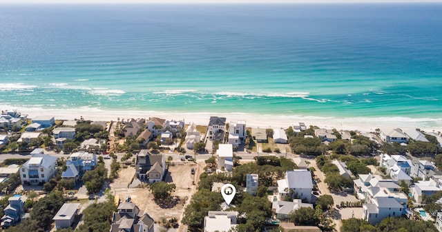 bird's eye view with a water view, a residential view, and a view of the beach