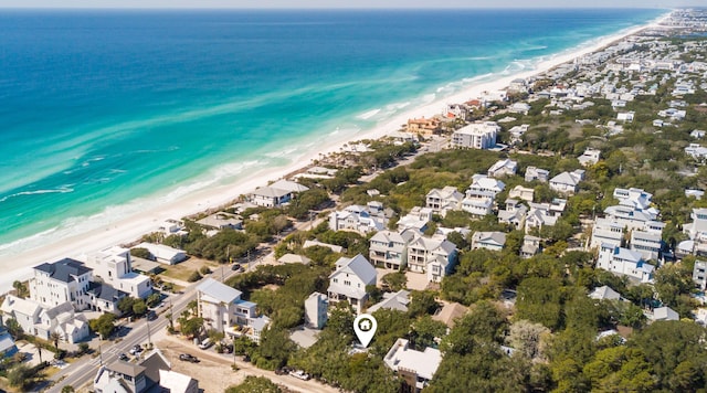 birds eye view of property with a water view, a residential view, and a view of the beach