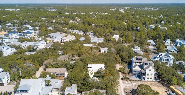 bird's eye view with a residential view and a wooded view