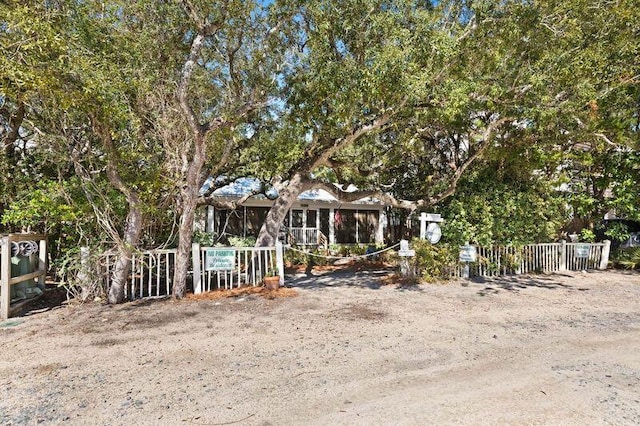 view of front of house featuring fence