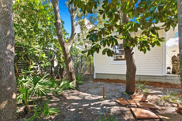 view of property exterior with fence