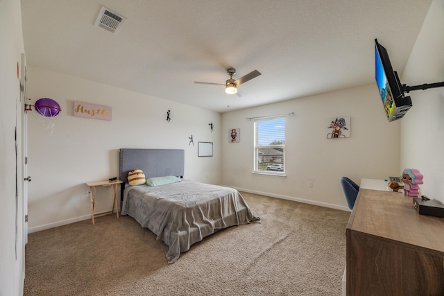 bedroom featuring ceiling fan, baseboards, visible vents, and light carpet