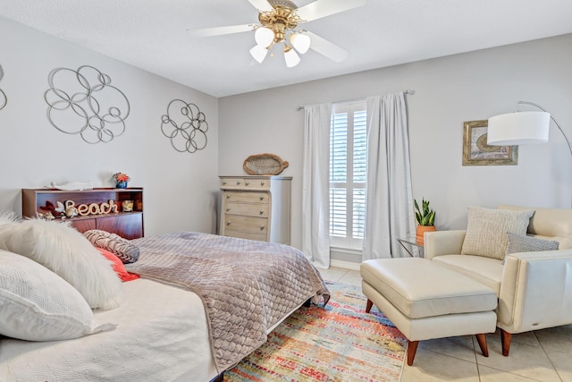 tiled bedroom with ceiling fan