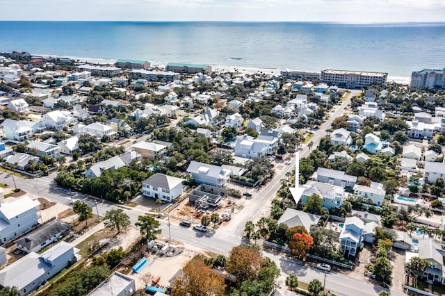 birds eye view of property with a residential view and a water view