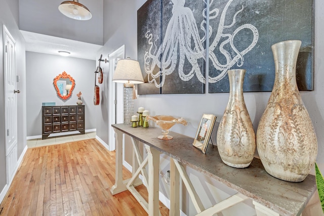 interior space featuring baseboards and hardwood / wood-style flooring