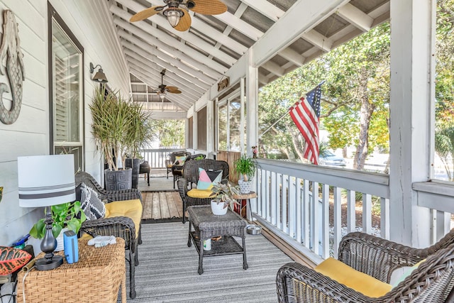 deck featuring a porch and ceiling fan