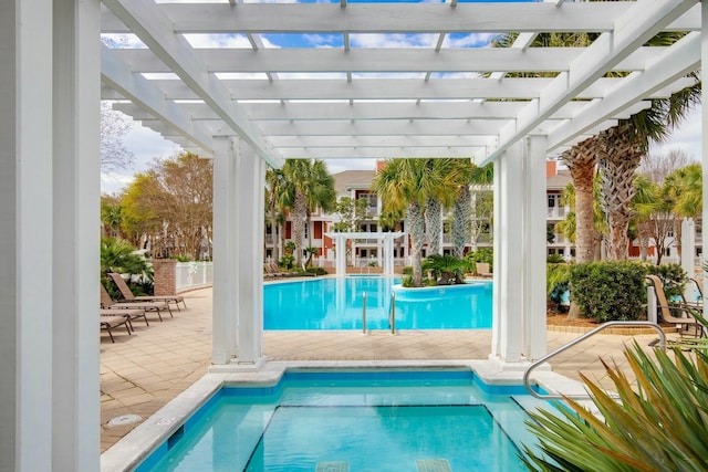 pool featuring a pergola and a patio