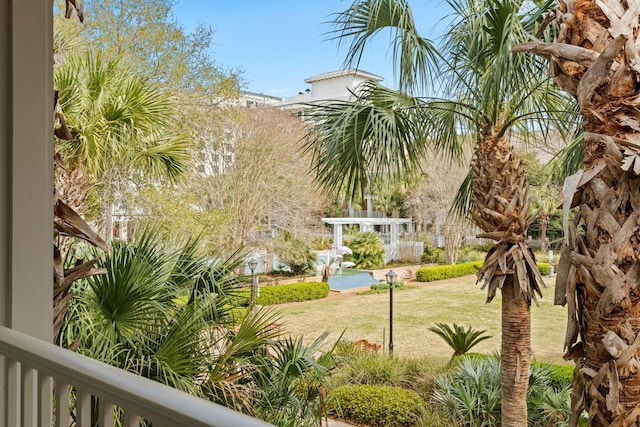 view of home's community featuring a lawn