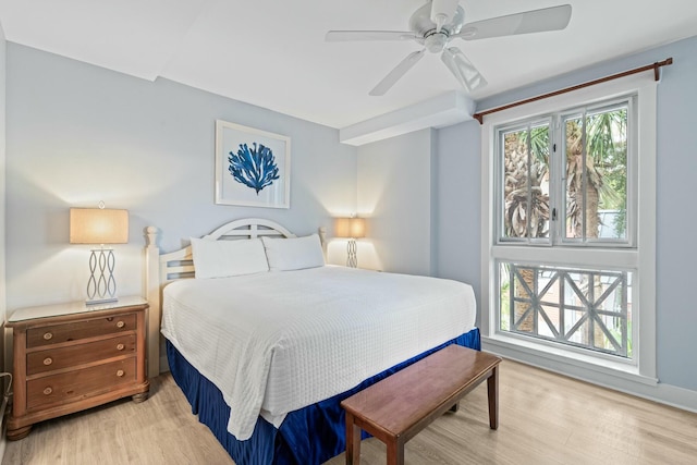 bedroom with light wood finished floors and ceiling fan