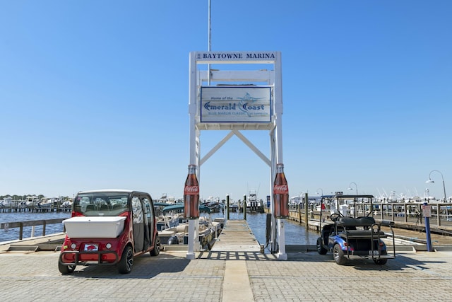 exterior space with a water view and a boat dock