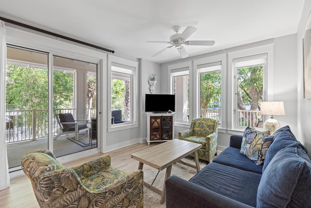 9100 Baytowne Wharf Blvd Unit 451, Miramar Beach, FL 32550 - living area with light wood finished floors, a ceiling fan, and baseboards