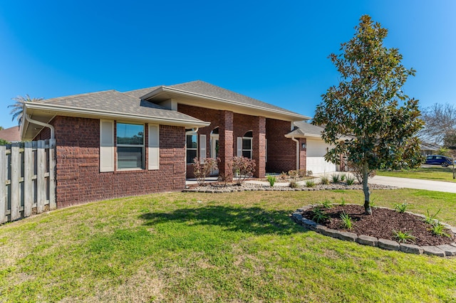 ranch-style house with brick siding, concrete driveway, an attached garage, fence, and a front lawn