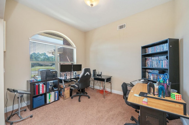 carpeted home office with visible vents and baseboards