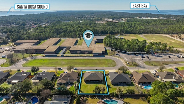 aerial view featuring a residential view and a view of trees