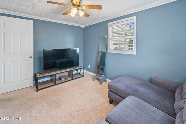 305 S Wells St, Panama City Beach, FL 32413 - carpeted living room featuring ornamental molding, ceiling fan, a textured ceiling, and baseboards